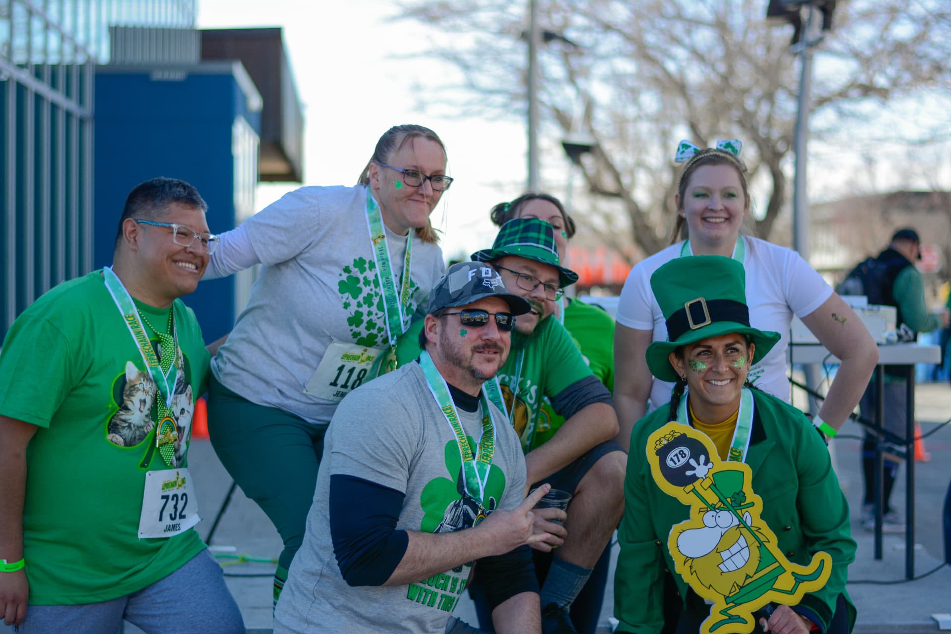 A lucky crew celebrating with their finisher medals