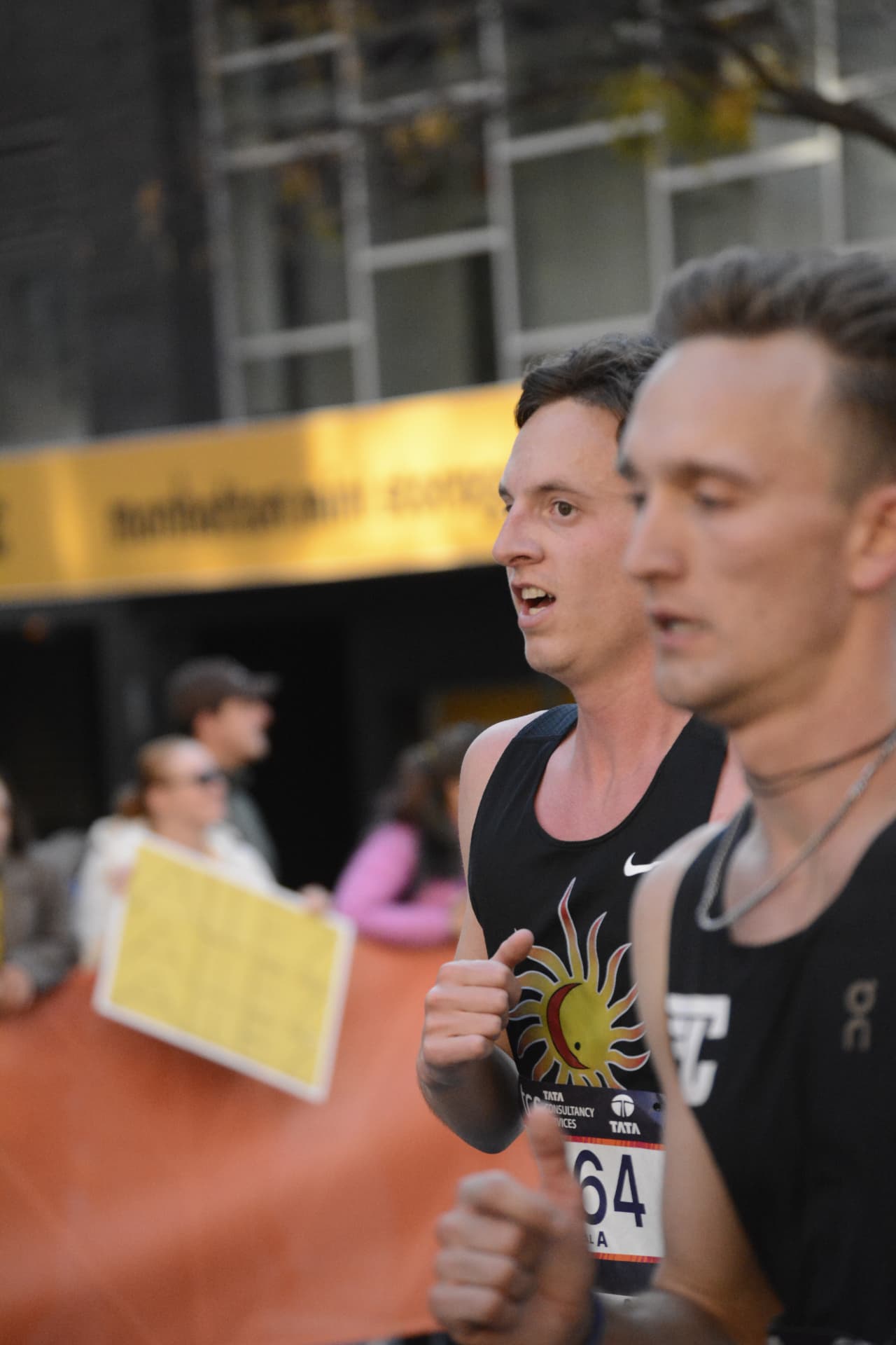 Two runners locked in mid-race through the five boroughs