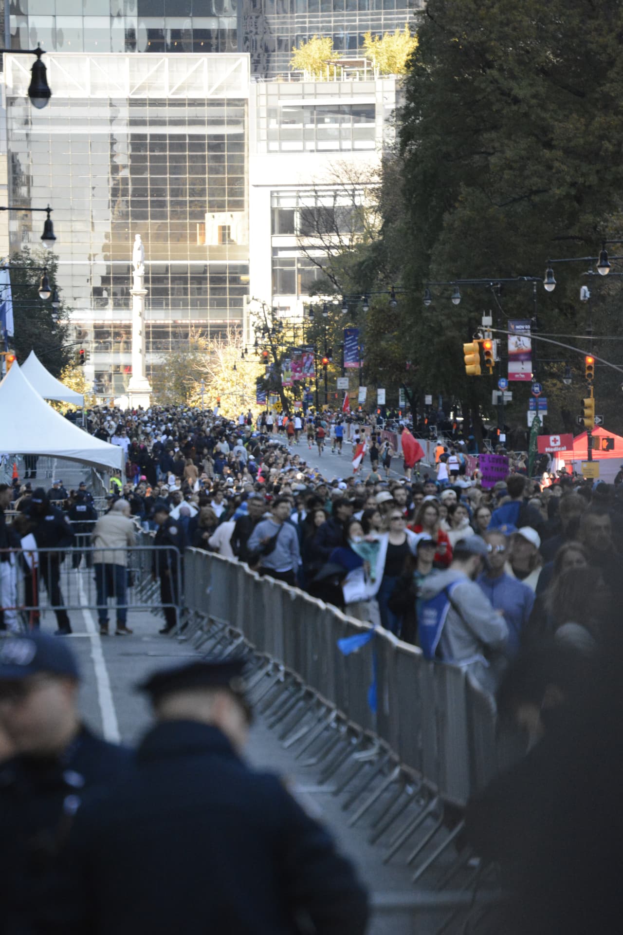 The marathon course packed with runners and crowds near Columbus Circle
